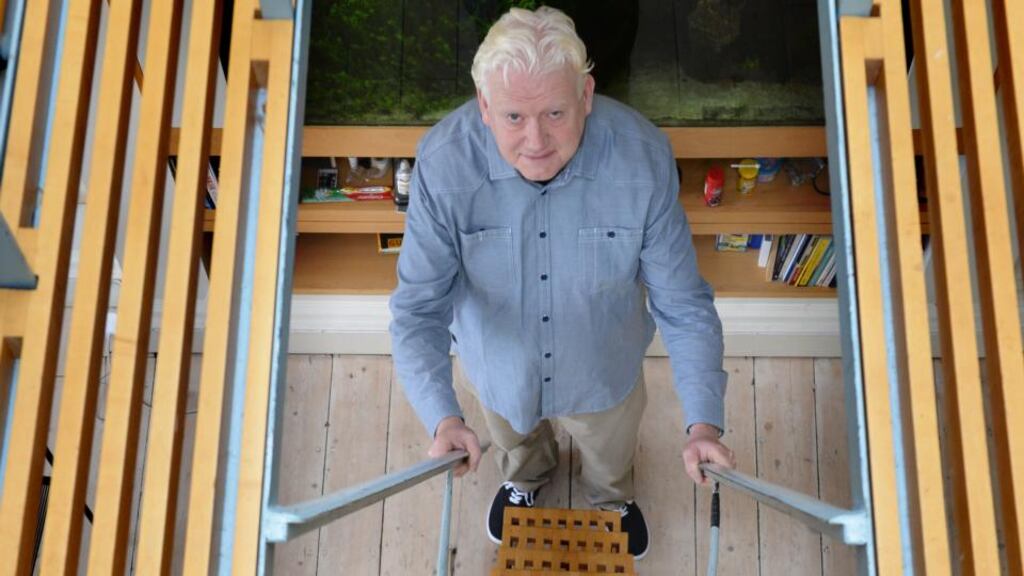 Ross Cahill O Brien at the steel maple staircase in his home. Photograph: Cyril Byrne