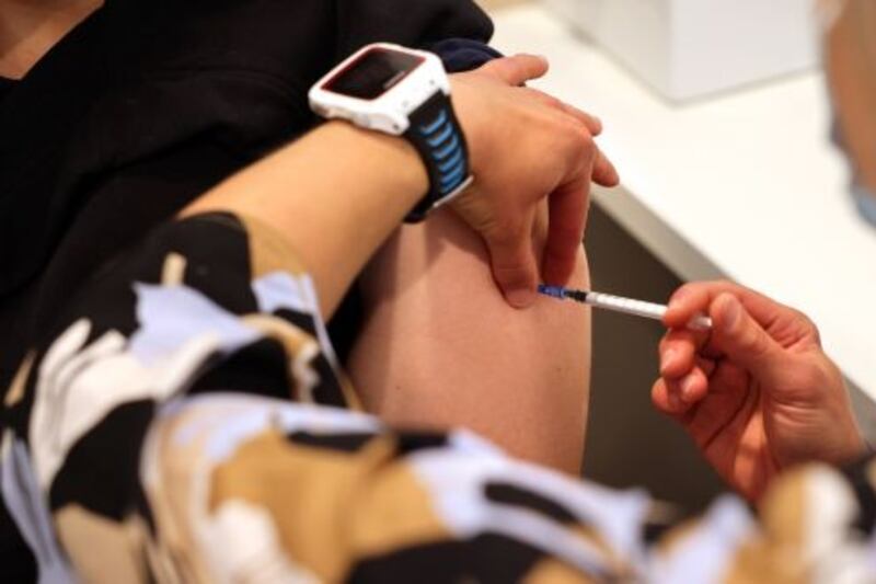 Boosters for over-50s expected as Covid wave threatens health service