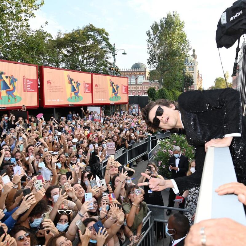 Timothée Chalamet poses with fans as he attends the red carpet of the movie Dune during the 78th Venice International Film Festival. Photograph: Pascal Le Segretain/Getty