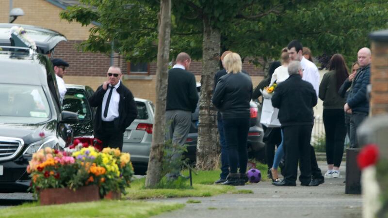 Family and friends gather outside a house on Balbutcher Drive in Ballymun before the funeral of Antoinette Corbally. Photograph:  Colin Keegan/Collins.
