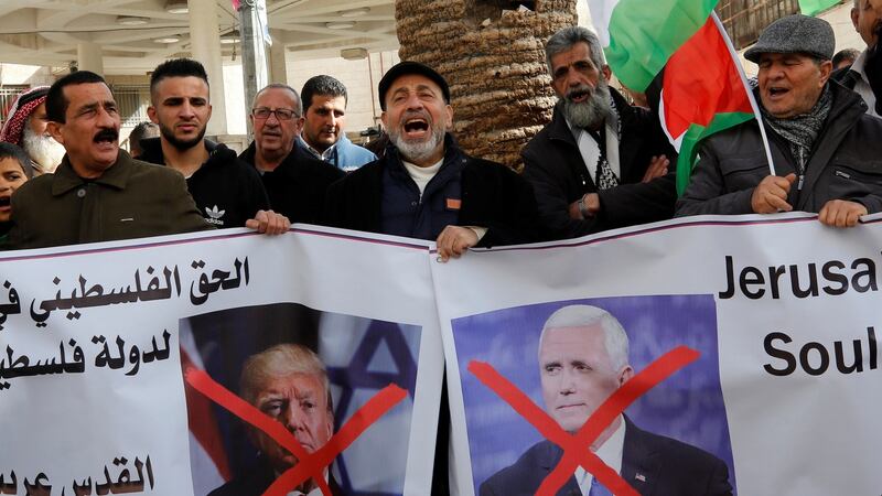Palestinian demonstrators shout slogans as they hold posters with  crossed out  images of US president Donald Trump and vice-president Mike Pence during a protest against Mr Pence’s visit to Israel, in the West Bank city of Nablus, earlier this week. Photograph: Abed Omar Qusini/Reuters