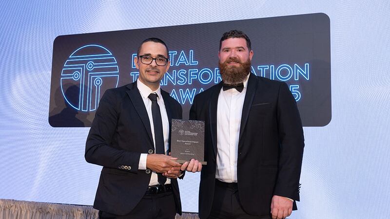 Pierangelo Rosati, awards judge, presents the best operational impact award to Richard Williams, Kinore