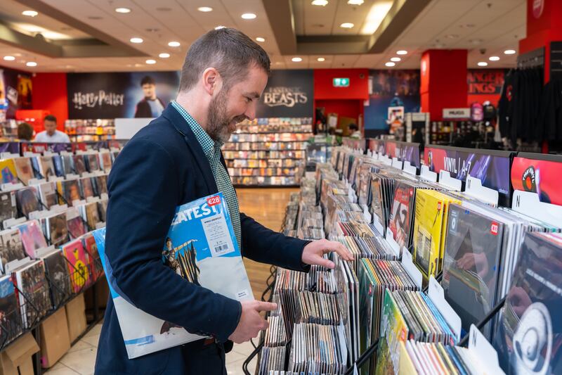 John Hoolahan, marketing director for AIB Merchant Services, browses the vinyl selection in Golden Discs: the Clover POS systems allow customers more time to focus on choosing their music