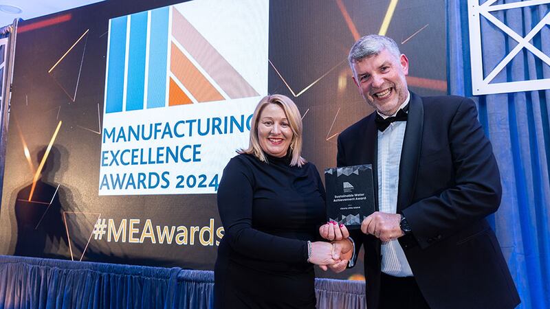 Joe O’Callaghan, programme director of UCC presents the sustainable water achievement award to Sinead O’Brien, Viatris Little island