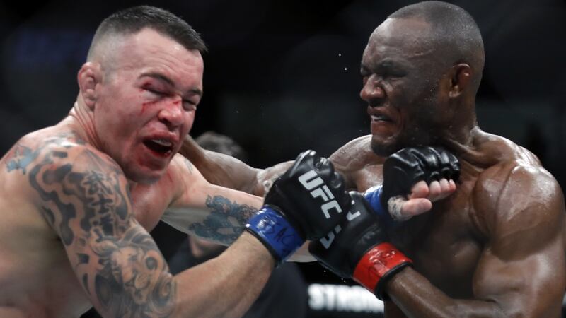 Colby Covington  takes a punch from UFC welterweight champion Kamaru Usman in their welterweight title fight last December in Las Vegas. Photograph: Steve Marcus/Getty Images