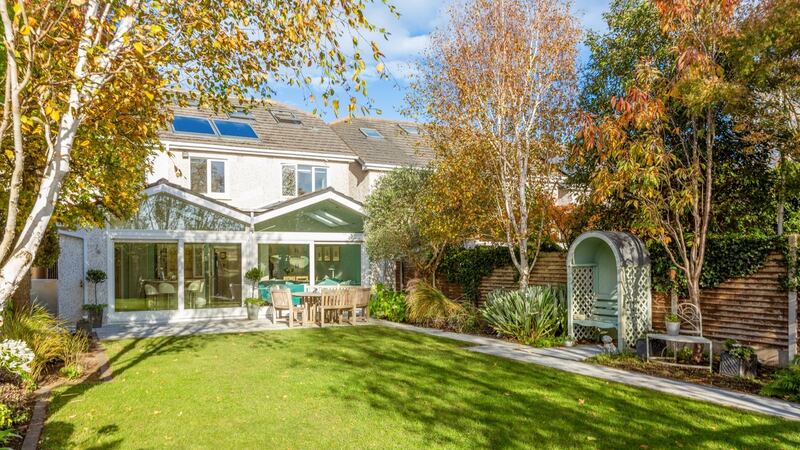Southwest facing back garden with patio, lawn and well-stocked beds at 121 Stillorgan Heath