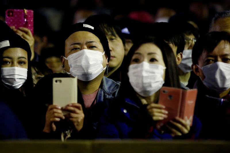 Coronavirus: China reports slight fall in new cases as total passes 68,000