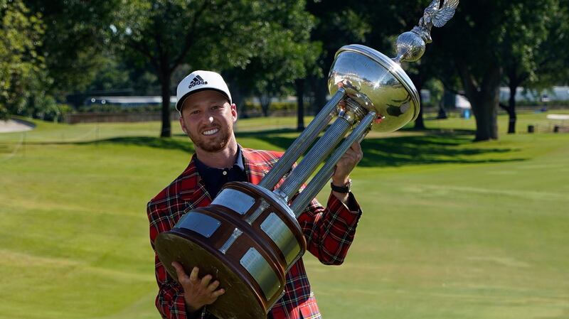 Daniel Berger celebrates his victory in the Charles Schwab Challenge. Photograph:  David J. Phillip/AP