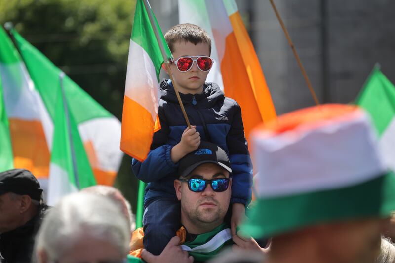 A father and son among the crowd gathering at the GPO in Dublin as part of a protest demanding a referendum on the EU migration pact. Photo: Bryan O’Brien/The Irish Times 