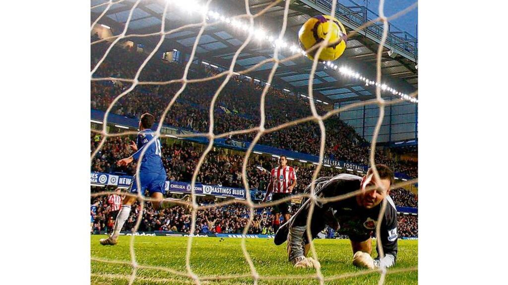 Chelsea's Michael Ballack turns to celebrate his goal as Sunderland goalkeeper Marton Fulop looks helplessly on during the English Premier League match at Stamford Bridge.