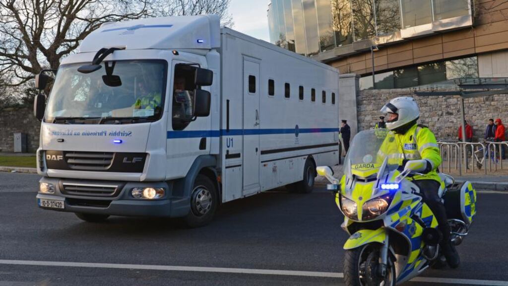 Eight people are escorted from the Special Criminal Court in Dublin in 2013: the Act permitting the avoidance of a jury trial has been criticised by civil liberties groups. Photograph: Eric Luke