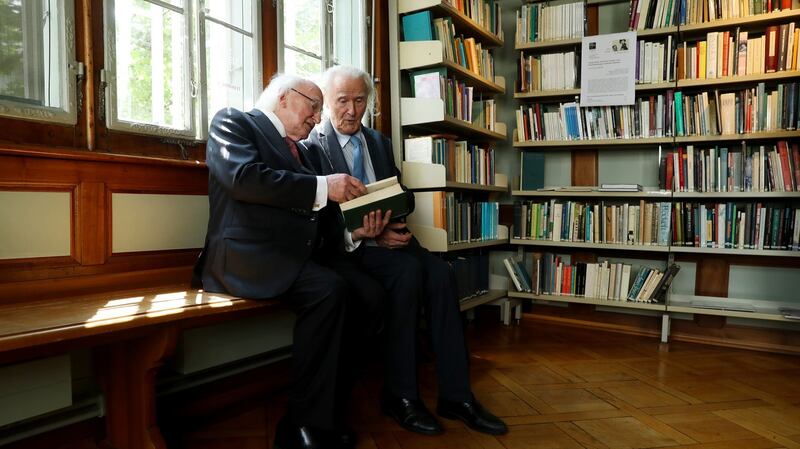 President Michael D Higgins speaking to Dr Fritz Senn, director of the James Joyce Foundation, during a visit to the foundation in Zurich, Switzerland. Photograph: Maxwells