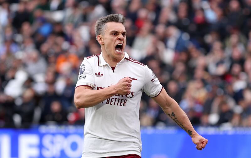 Leandro Trossard celebrates scoring for Arsenal against West Ham. Photograph: Justin Setterfield/Getty Images