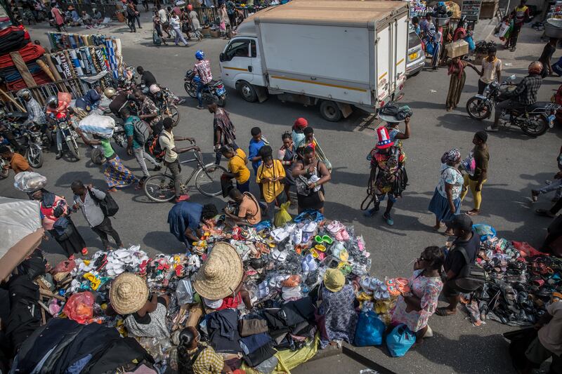 People shop near the Kantamanto Market, Accra, Ghana. Photograph: Sally Hayden