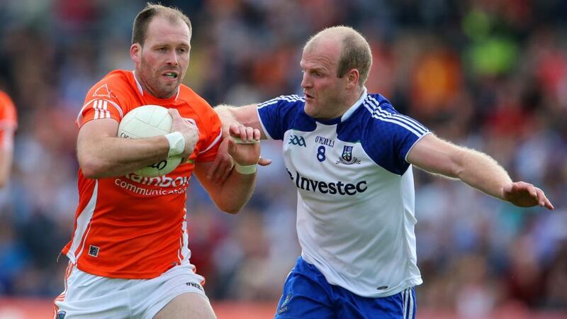 Ciarán McKeever getting tackled by Monaghan’s Dick Clerkin at St Tiernach’s Park, Clones. Photograph: Cathal Noonan/Inpho