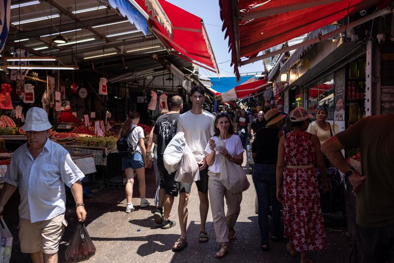 Israelis shop at the Carmel market in Tel Aviv on Wednesday amid regional tensions during the ongoing war between Israel and Hamas in the Gaza Strip. Photograph: Oren Ziv/AFP via Getty Images