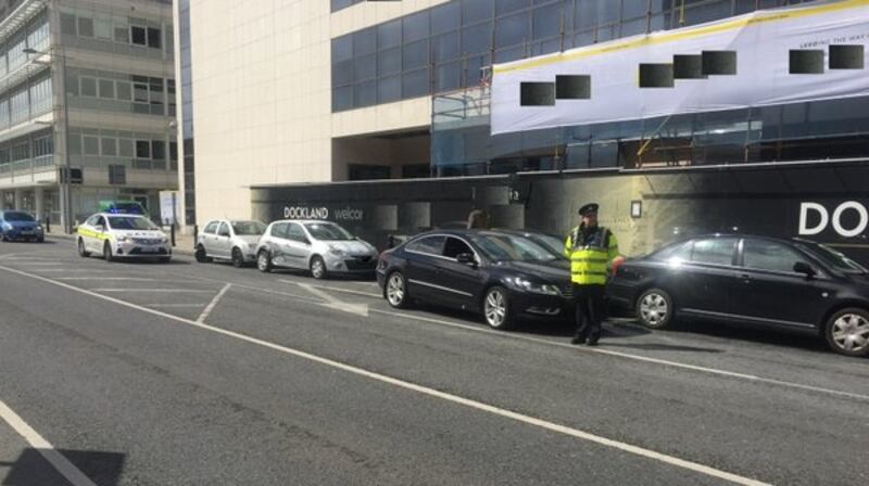 A woman was arrested by gardaí after causing material damage to four vehicles parked on Guild Street by the IFSC in Dublin 1. Photograph: And Garda Síochána