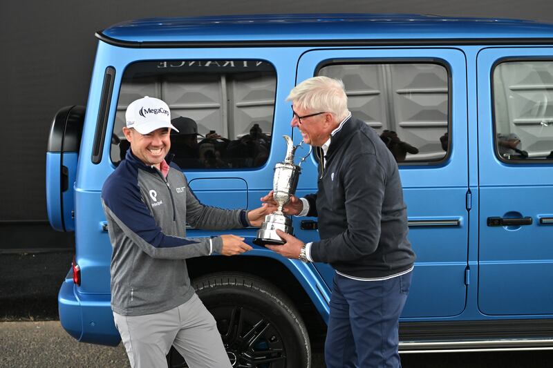 Brian Harman returns the Claret Jug to  CEO of The R&A Martin Slumbers ahead of the 152nd British Open at Royal Troon. Photograph: Andy Buchanan/AFP/Getty Images