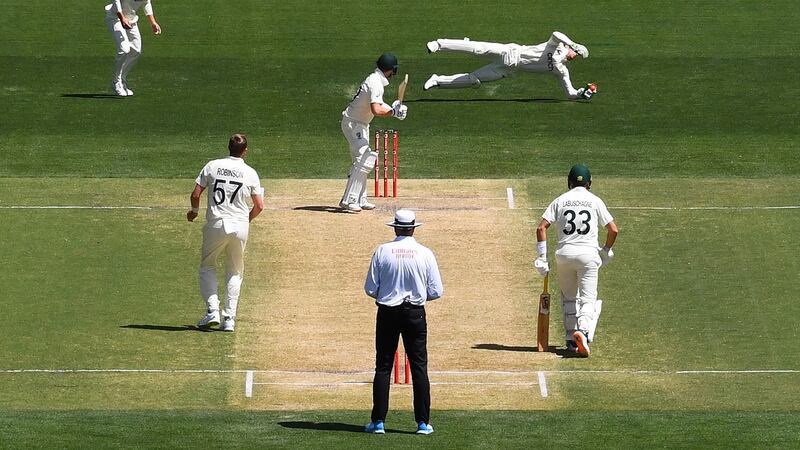 Jos Buttler catches from Steve Smith. Photo: Dave Hunt/EPA