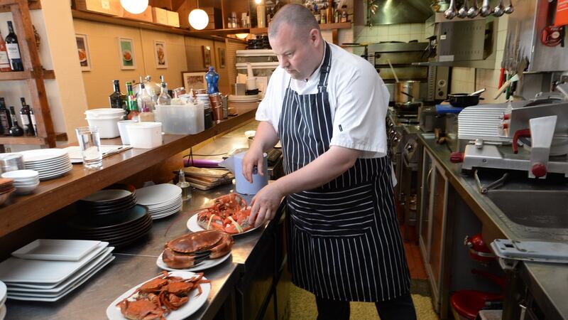 Gaz Smith, at Michael’s restaurant in Mount Merrion, preparing the recently landed lobster and crab. Photograph: Dara Mac Dónaill