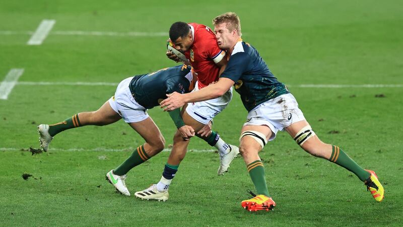 Lions wing Anthony Watson is tackled by South Africa A  fullback Willie Le Roux (l) and Pieter-Steph du Toit during the match  at Cape Town Stadium. Photograph: David Rogers/Getty Images