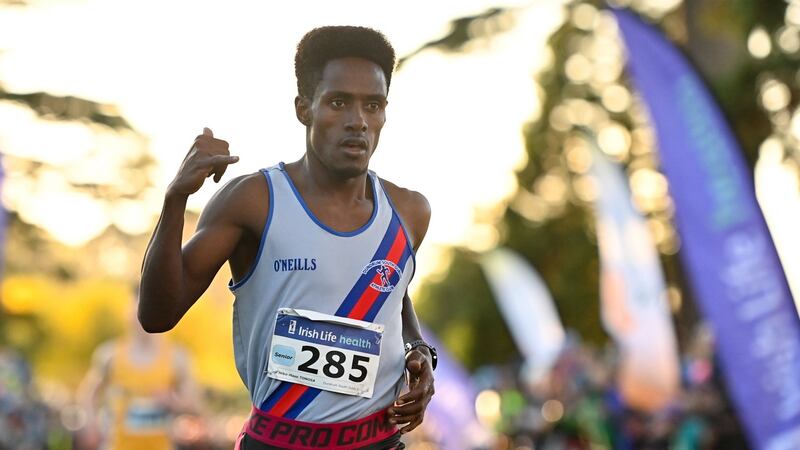 Hiko Tonosa celebrates winning the senior men’s event during the Irish Life Health National Cross- Country Championships at Santry Demense in Dublin on Sunday. Photograph:  Ramsey Cardy/Sportsfile