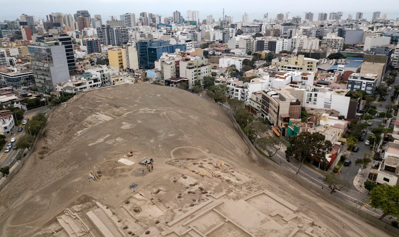 Workers excavate at Huaca Pucllana in Lima, where archaeologists uncovered a mummy from the pre-Inca Ychsma culture buried in a shallow funerary chamber on an ancient sanctuary. Photograph: Cris Bouroncle/AFP via Getty Images