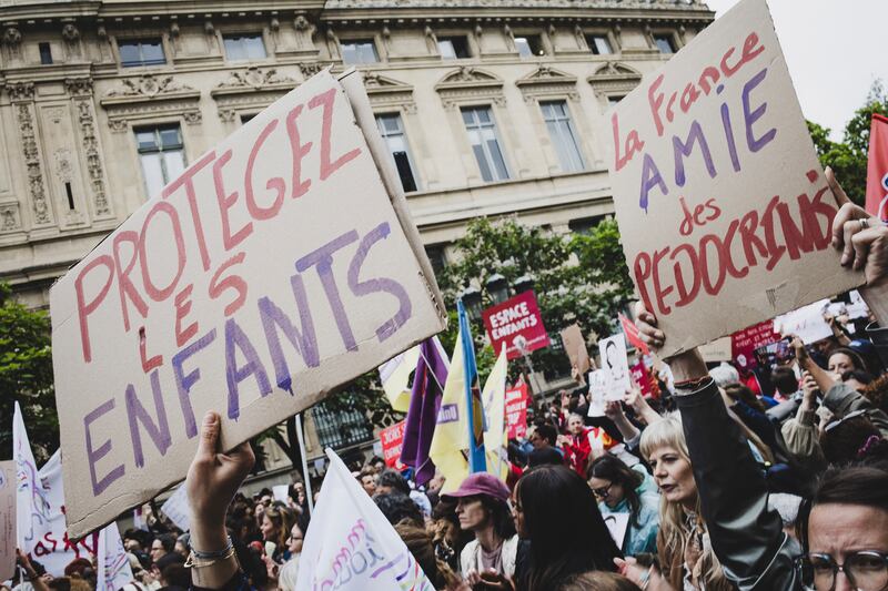 Protesters in Paris hold signs denouncing the state of justice and the fight against crimes against children. Photograph: Daniel Perron / Hans Lucas / AFP via Getty Images