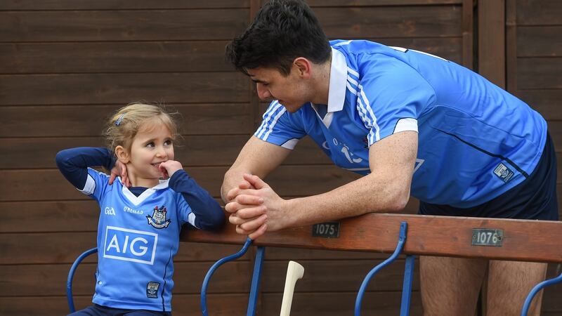 Dublin hurler Danny Sutcliffe with young Dub, Clodagh Quinn, age 4, in Parnell Park to kick off the 2018 Dublin GAA Season. Photograph by David Fitzgerald/Sportsfile
