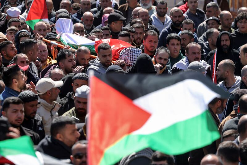 Mourners carry the remains  of three Palestinians killed in a reported attack by Israeli settlers in the town of Abu Falah, northeast of Ramallah in the occupied West Bank, earlier ths week. Photograph: Zain Jaafar/AFP/Getty Images