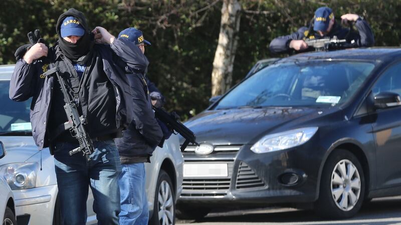 Members of the gardai, Customs, CAB, the Special Detective Unit and officers from the emergency response unit are taking part in a series of raids on homes in Dublin city centre on Friday. Photograph: Collins