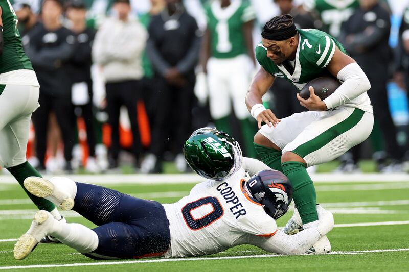 New York Jets quarterback Justin Fields is sacked by Jonathon Cooper of the Denver Broncos during the game at Tottenham Hotspur Stadium. Photograph: Laszlo Geczo/Inpho