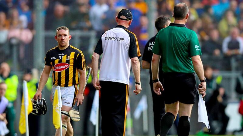 Kilkenny’s Richie Hogan walks past manager Brian Cody after being sent off during the All-Ireland hurling final at Croke Park. Photograph: Tommy Dickson/Inpho