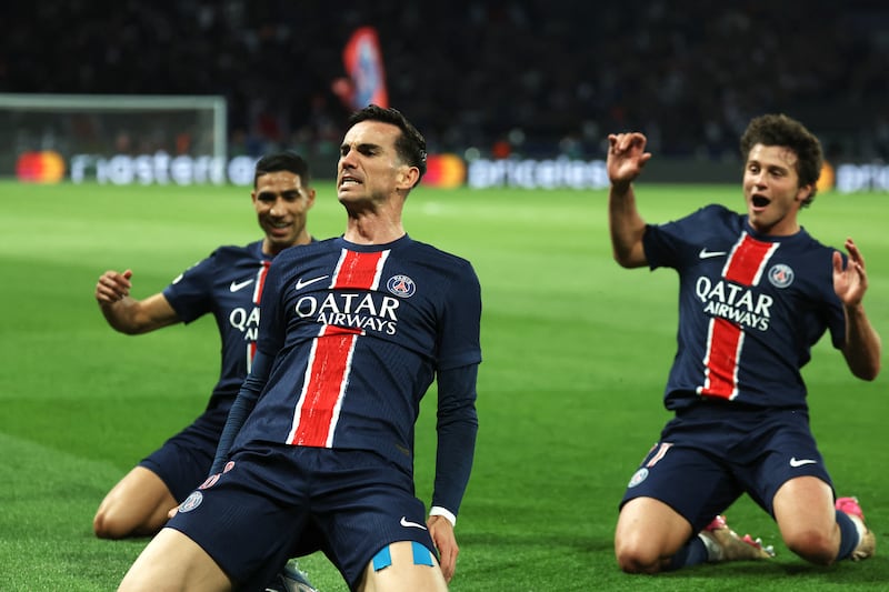 Fabian Ruiz celebrates with Achraf Hakimi and Joao Pedro Goncalves Neves after scoring the opening goal. Photograph: Thomas Samson/AFP via Getty Images