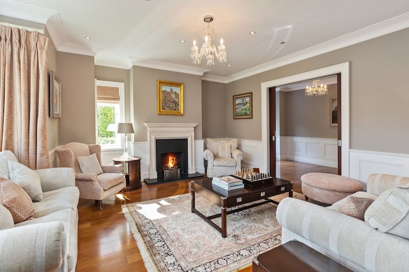 A drawing room has pocket doors for entertaining 