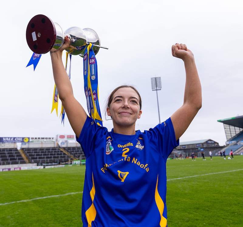 St Finbarr's captain Stephanie Punch lifts the trophy following victory against De La Salle in the Munster Club Senior Camogie Championship final at Semple Stadium, Thurles. Photograph: Tom O'Hanlon/Inpho