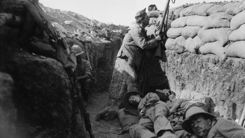 Gallipoli –  Royal Irish Fusilier attempts to draw fire of a Turkish sniper. Photograph: Lieut Ernest Brooks/ IWM via Getty Images