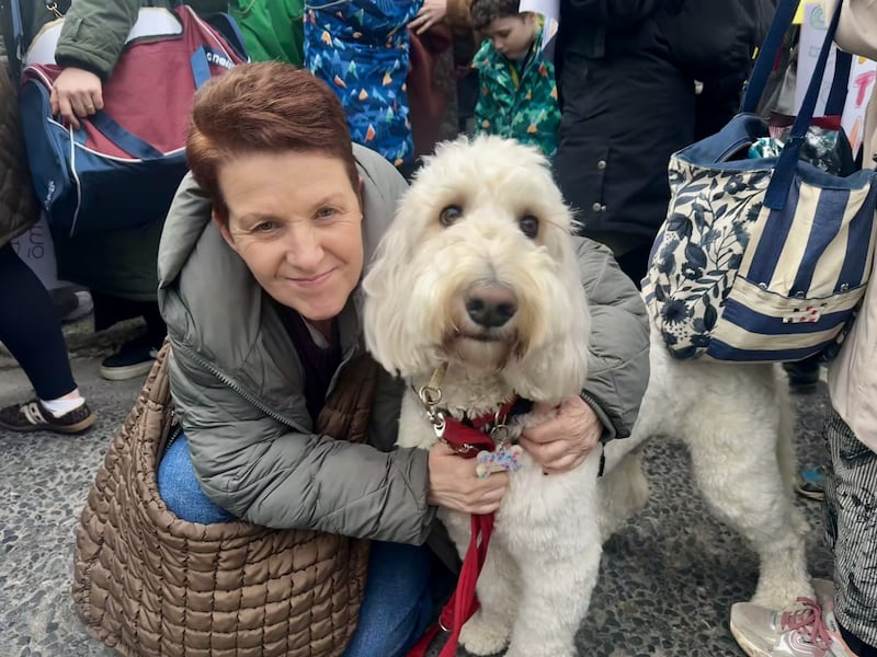 Michelle Adebisi and school service dog Diego from Bray at the demonstration outside Leinster House. Photograph: Bairbre Holmes/PA Wire