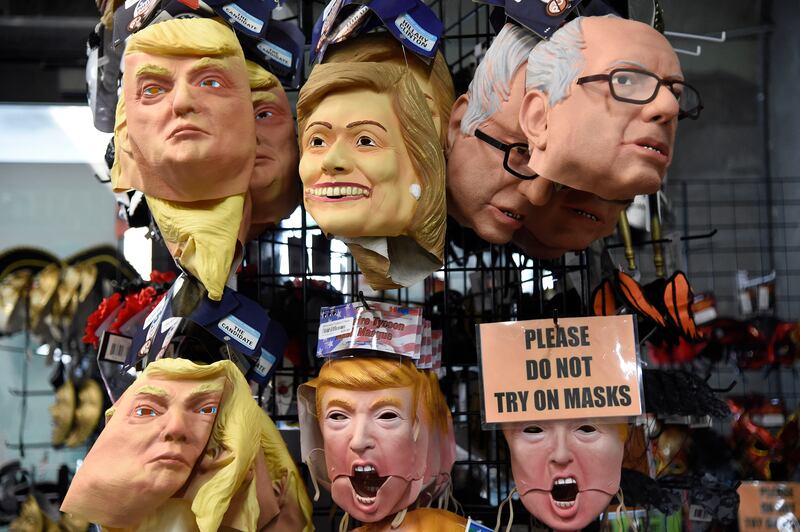 Masks of Donald Trump, Hillary Clinton and Bernie Sanders hang in a Halloween store in Miami, Florida. Photograph: Rhona Wise/AFP via Getty Images