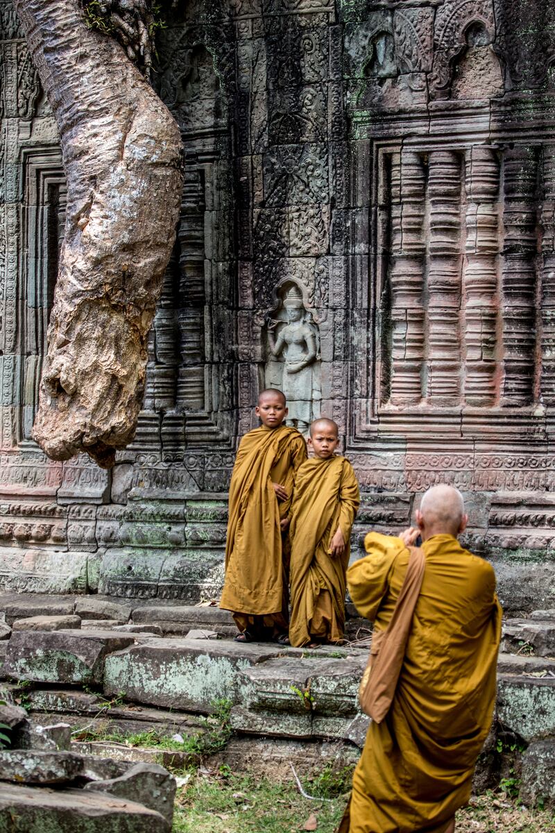 Monks at Angkor temple. Photograph: Getty