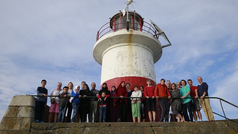 The al-Sulaimans (from left): Fatima Al-Zahraa; Douha;  Khaled  and Ilham; Abdelhi; Hayat; Mohammed; Batoul and Mustafa with members of Wicklow Syria Appeal including Jack Kinkead, Trass Lyons, Mary Aldridge, Angela Higgins, Steph Fox, Katie Jennings, David Ryan, Mick Nolan, Peter Shearer, Paula Kearney, Mary Rose Devereux, Jess Costello, Alex Costello and  Kate Costello. Photograph: Nick Bradshaw