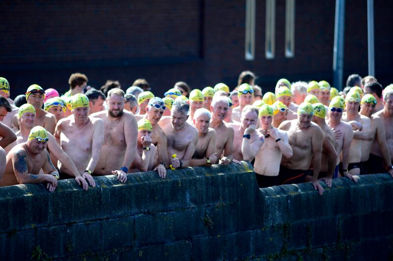 Swimmers  at the start of the men's race during the annual Liffey Swim. Photograph: Cyril Byrne