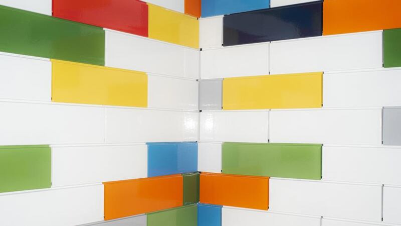 Tiles that resemble Lego bricks, at the Lego House in Billund: Lego emits about one million tons of carbon dioxide each year, about three-quarters of which comes from the raw materials that go into its factories. Photograph: Carsten Snejbjerg/New York Times