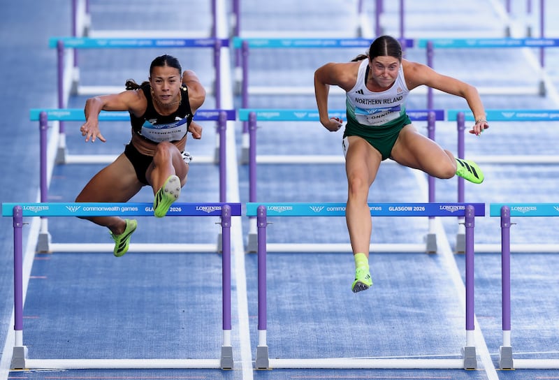 Kate O'Connor in action during the 100m hurdles in a rainy Glashgow at the Commonwealth Games. Photograph: Paul Harding/Getty Images