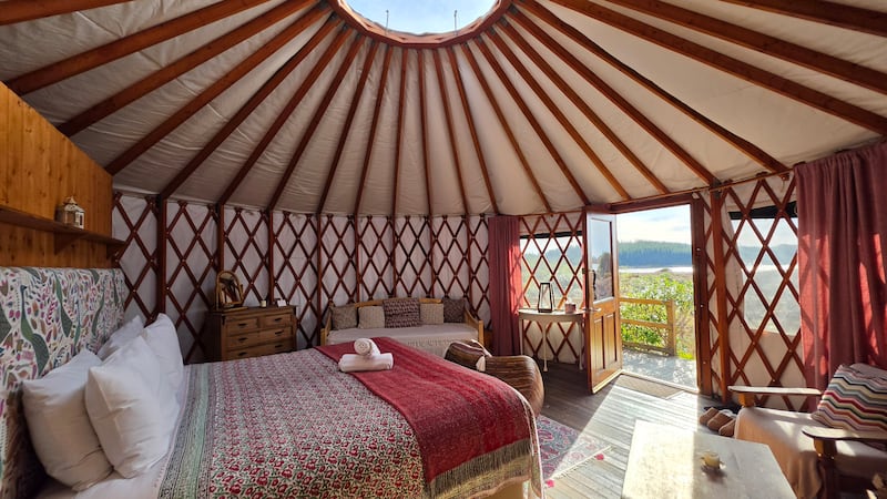 Built using breathable cob material and furnished with squashy sofas, a vast fireplace and a well-equipped kitchen, the roundhouse is an electronics-free zone