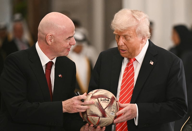 Fifa president Gianni Infantino gives US president Donald Trump a football to autograph during a signing ceremony after a state dinner with Qatar's Emir Sheikh Tamim bin Hamad al-Thani in Doha on May 14th. Photograph: Brendan Smialowski/AFP via Getty Images