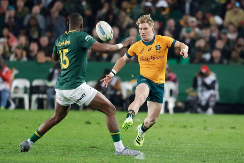 Australia's Nick Champion de Crespigny kicks the ball over South Africa's Aphelele Fassi as the Wallabies turned on the style against the Springboks. Photograph: Wikus De Wet/AFP via Getty Images