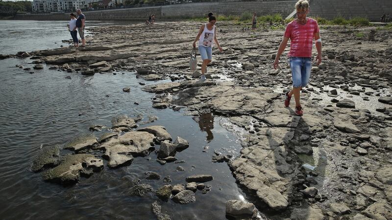A dried-out portion of the Elbe riverbed that under normal conditions would be submerged under water, during hot weather in Magdeburg, Germany. Shrinking rivers are exposing munitions left over from the second World War. Photograph: Sean Gallup/Getty Images
