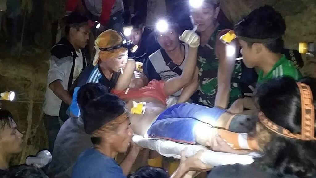 Indonesian Search And Rescue Agency (BASARNAS) rescuers evacuate a survivor from a collapsed gold mine in Bolaang Mongondow, North Sulawesi, Indonesia. Photograph: Basarnas/AP