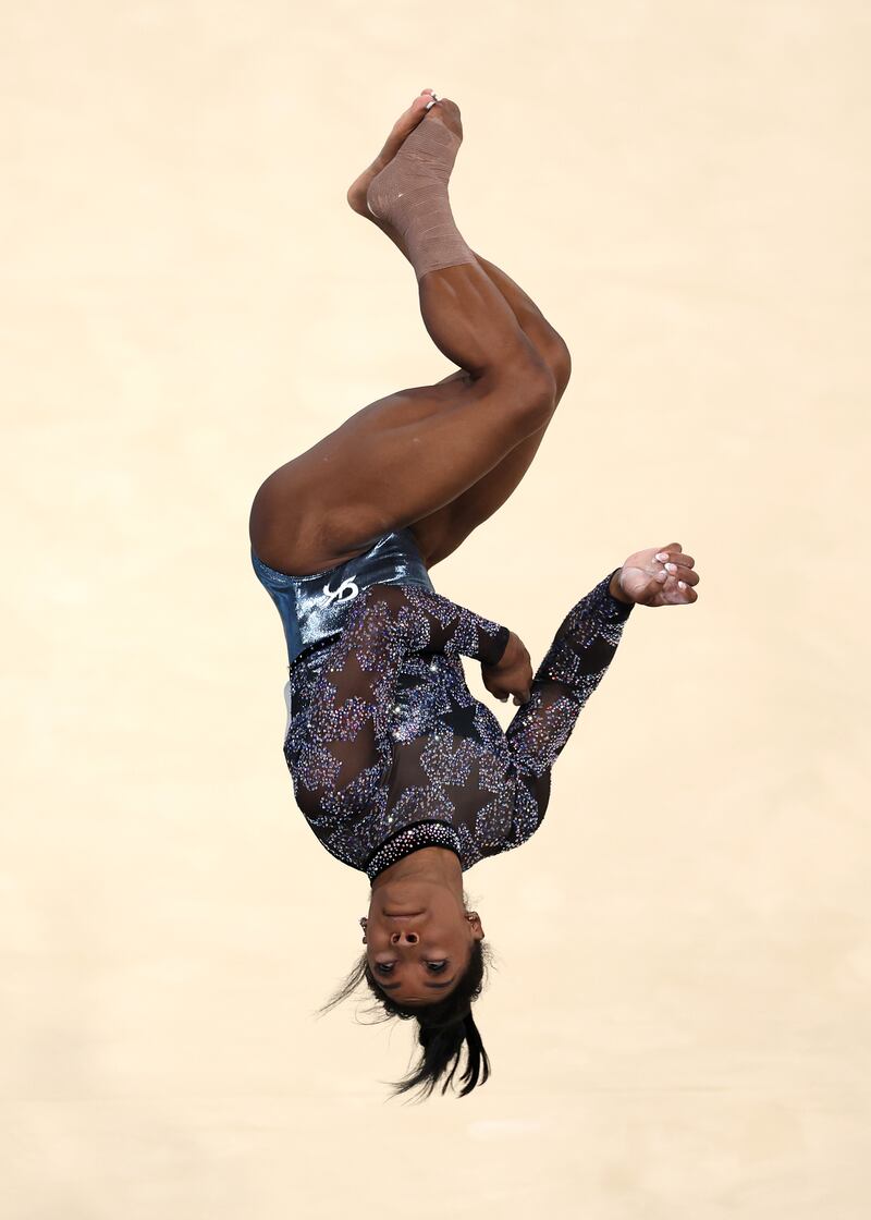 Simone Biles competes in the floor exercise at the Bercy Arena. Photograph: Maja Hitij/Getty Images